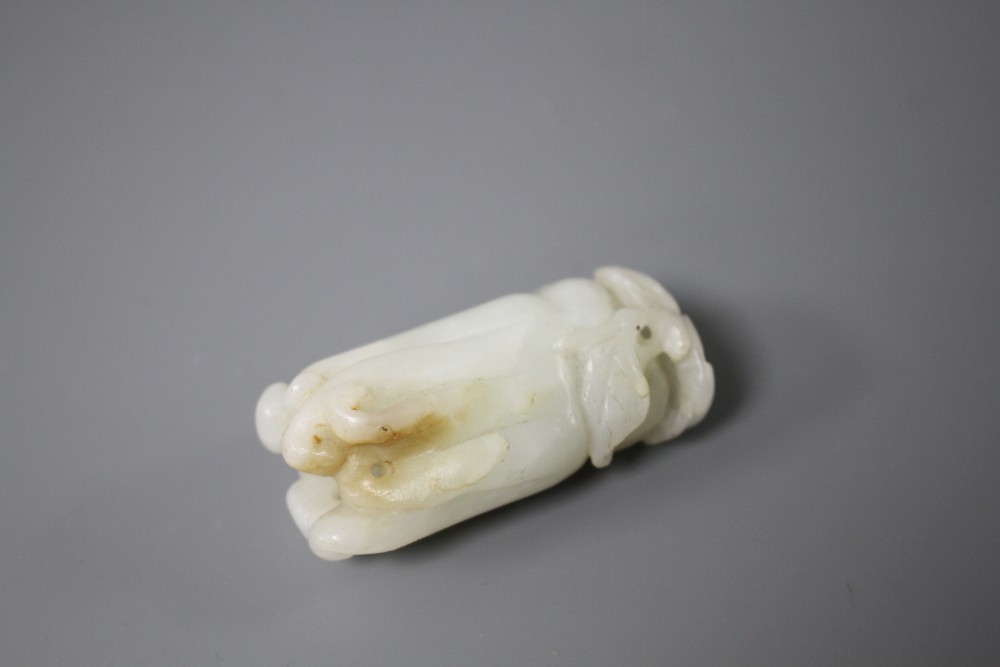 A Chinese jade carving of a finger citron, length 5.5cm, width 2.5cm, depth 2cm